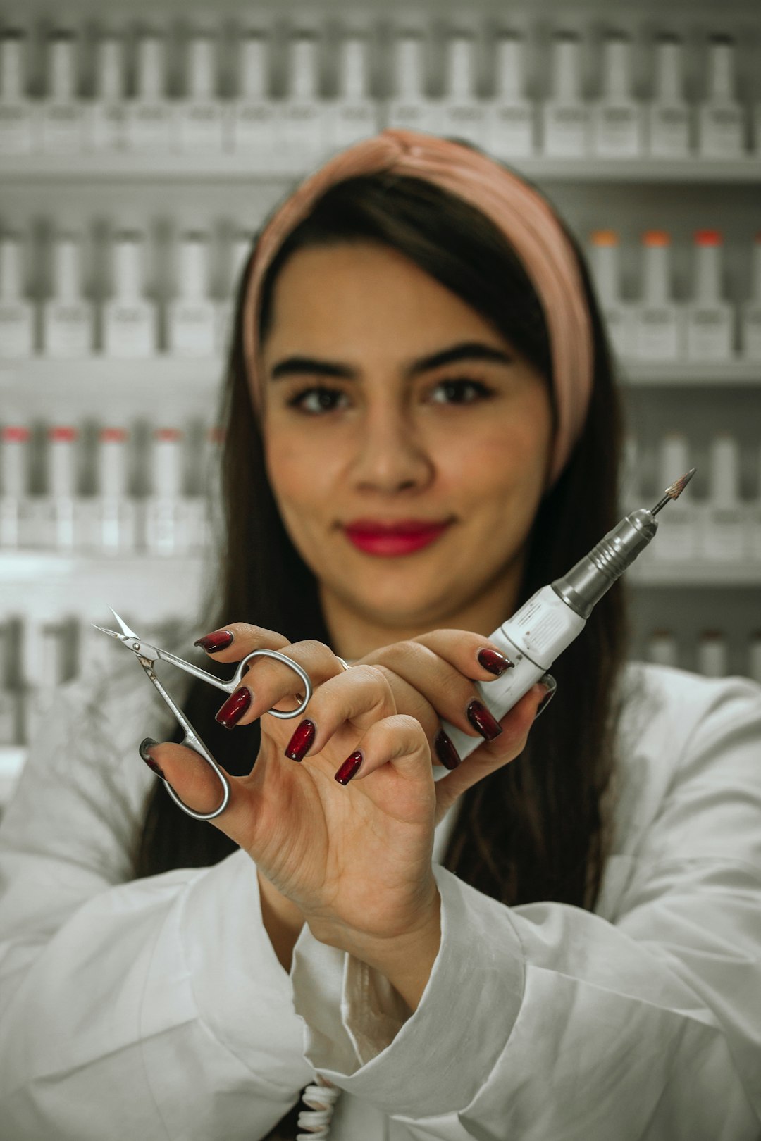 a-woman-holding-a-pair-of-scissors-in-her-hands-xq-jlcle1v0